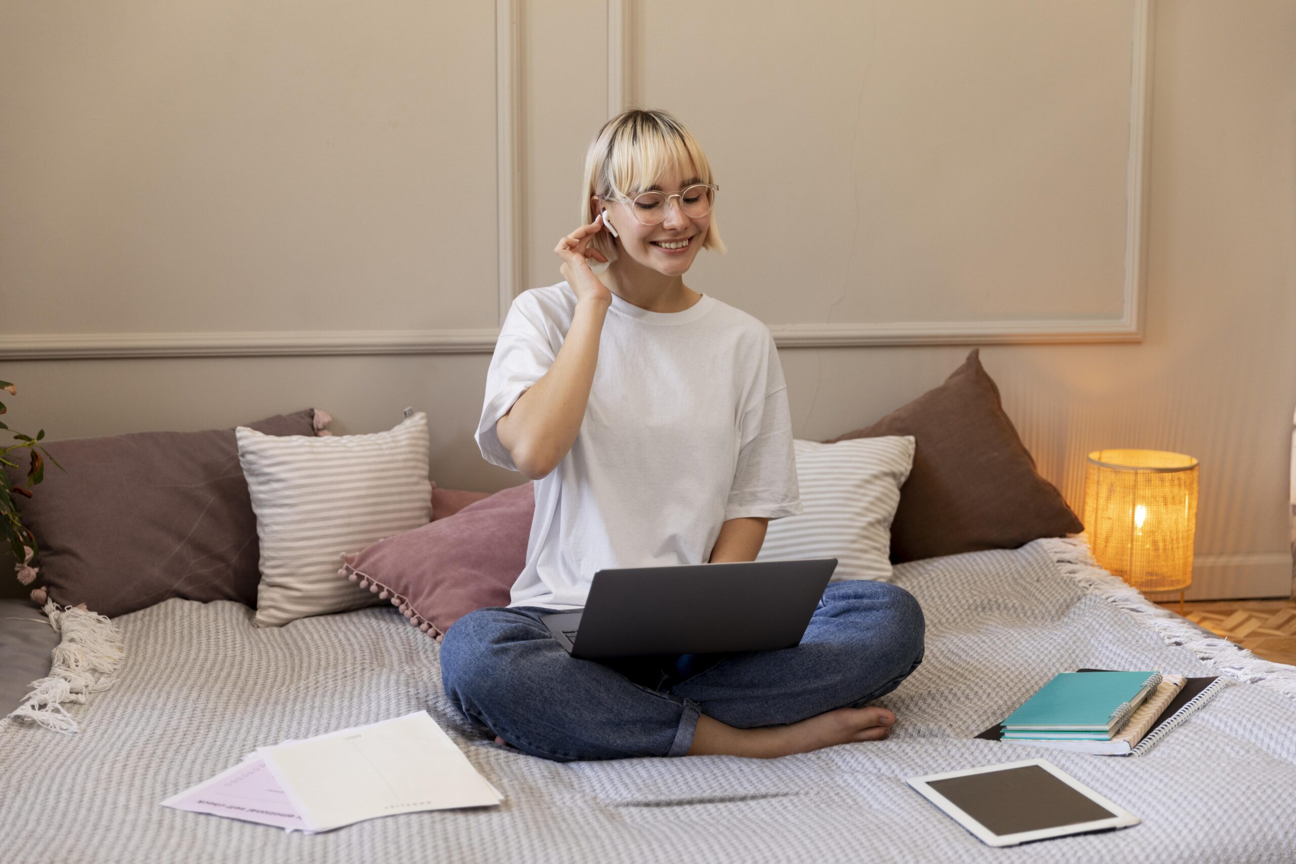 young-blonde-woman-working-from-home-her-laptop